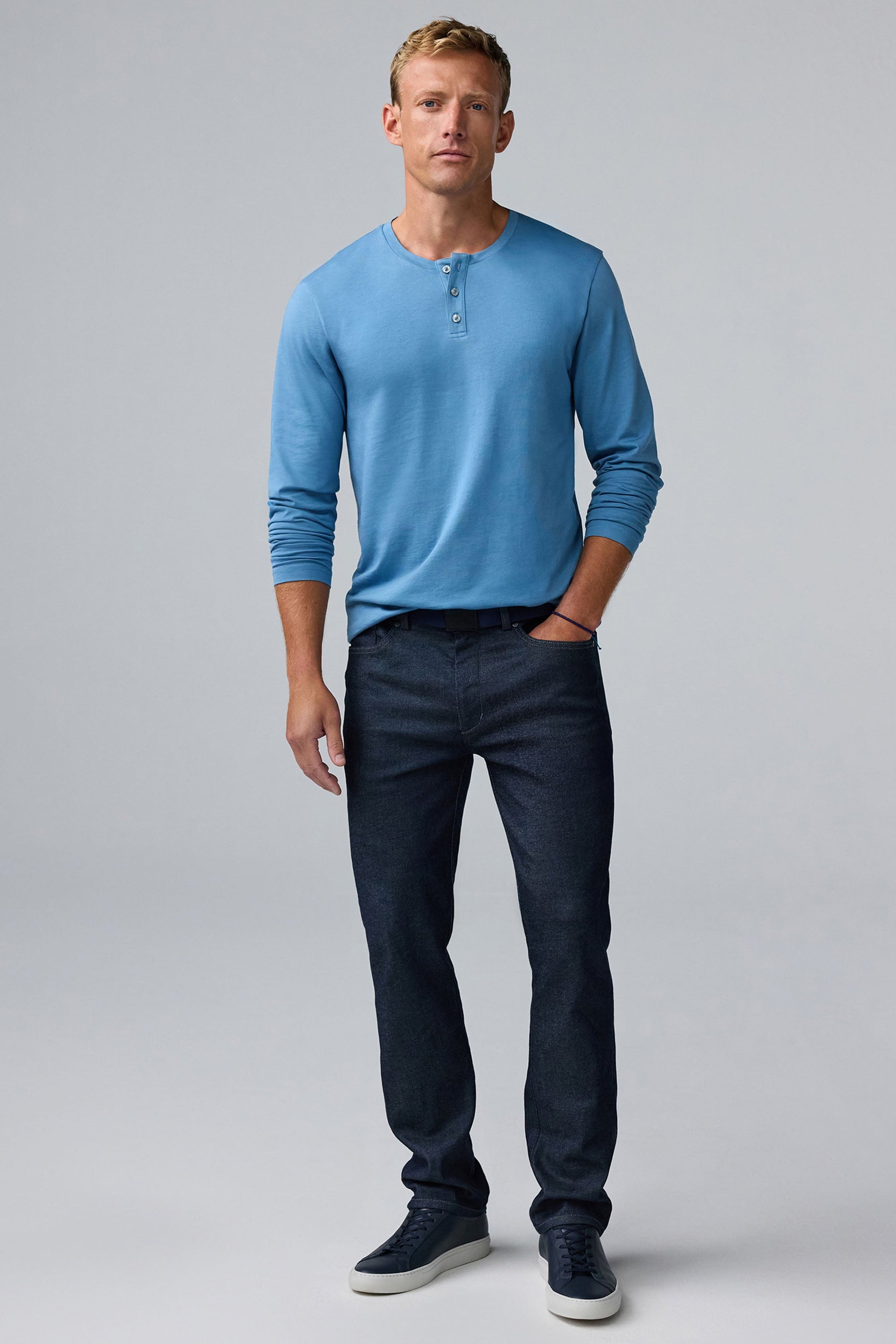 Full body front view of man wearing Pima Long Sleeve Henley in Blue Heaven