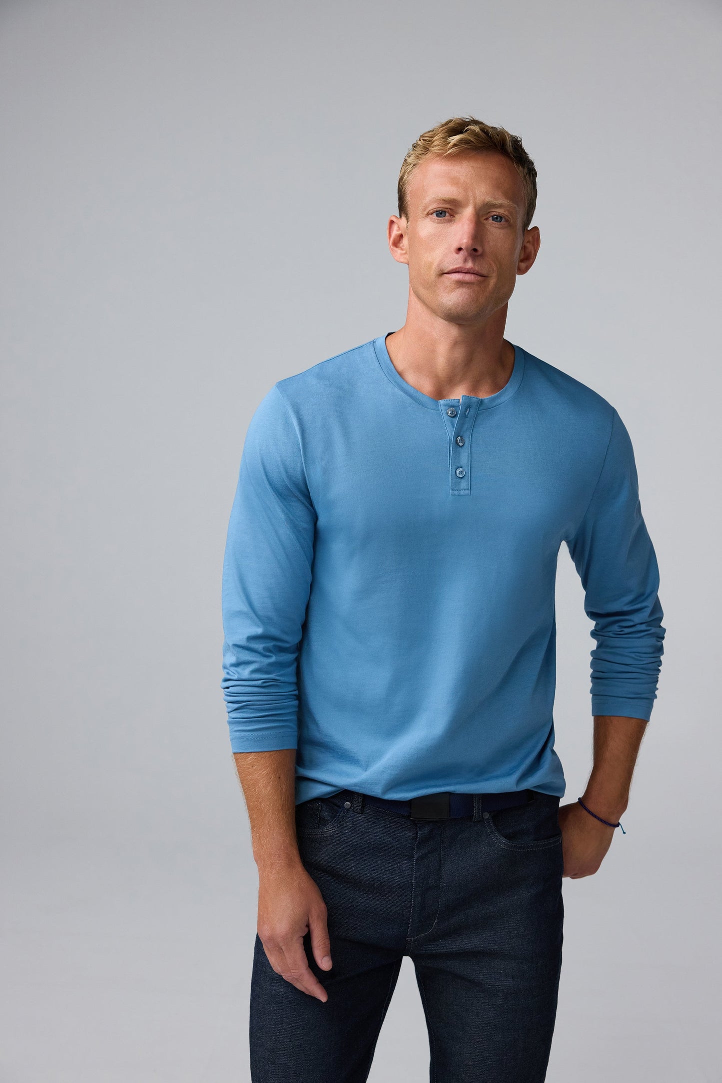 Front view of man wearing Pima Long Sleeve Henley in Blue Heaven