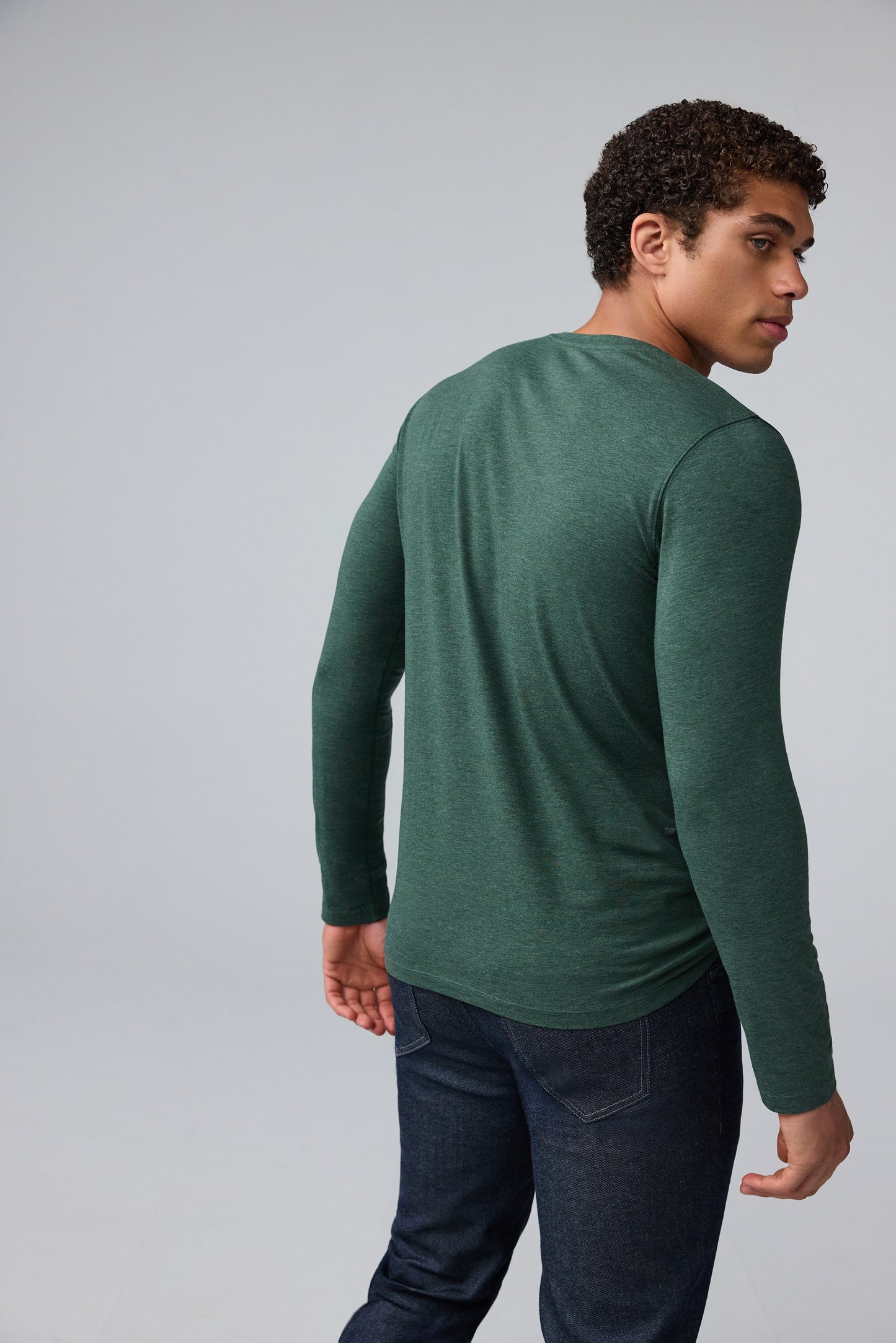 Back view of man wearing SILVER Long Sleeve T-Shirt in Tannenbaum Heather