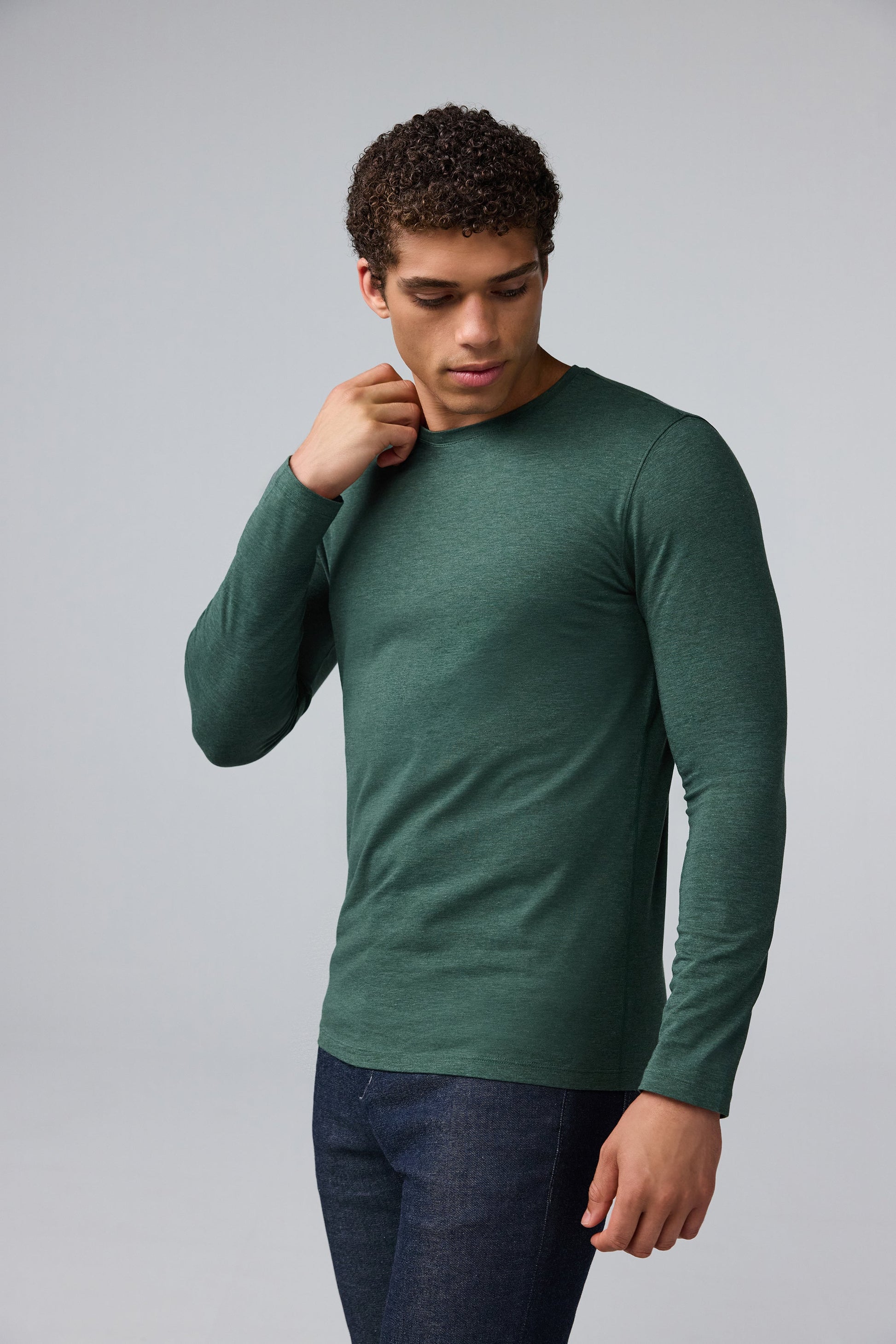 Side view of man wearing SILVER Long Sleeve T-Shirt in Tannenbaum Heather
