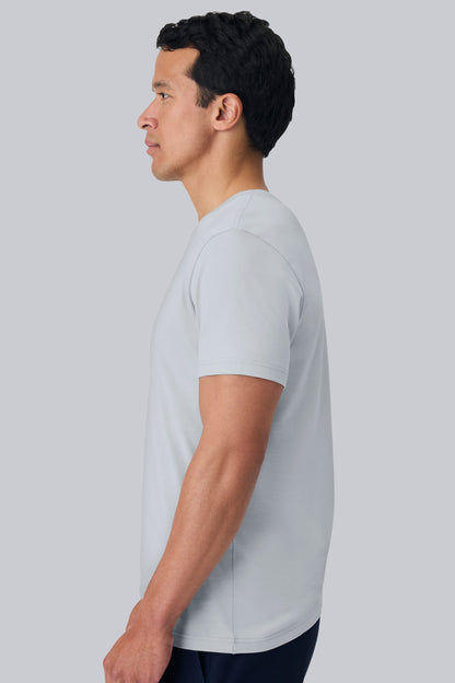 Side view of a man wearing Pima Crew Neck T-shirt in Steam
