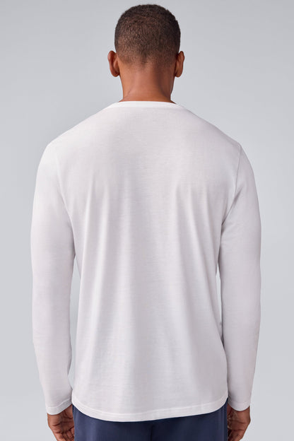 Back view of a man wearing Pima long sleeve T-shirt in Bright White