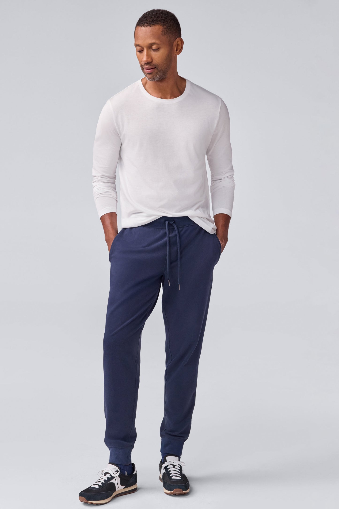 Full front view of a man wearing Pima long sleeve T-shirt in Bright White