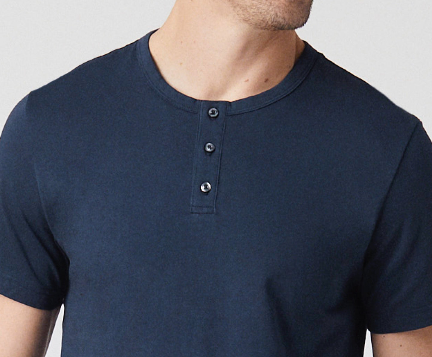 Front close up view of man wearing Pima Short Sleeve Henley in True Navy