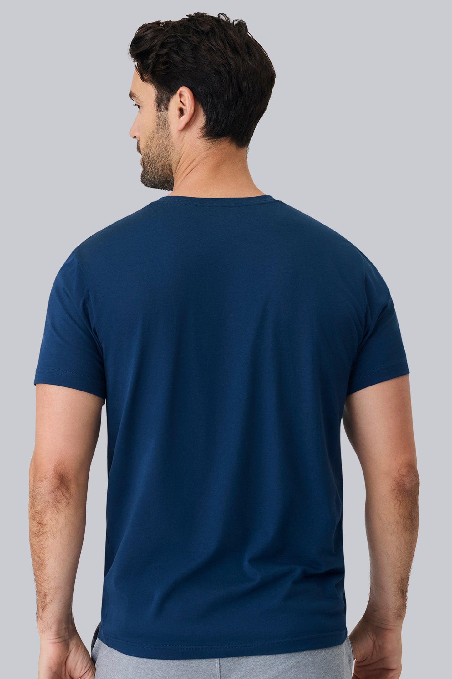 Back view of a man wearing Pima V Neck in True Navy 