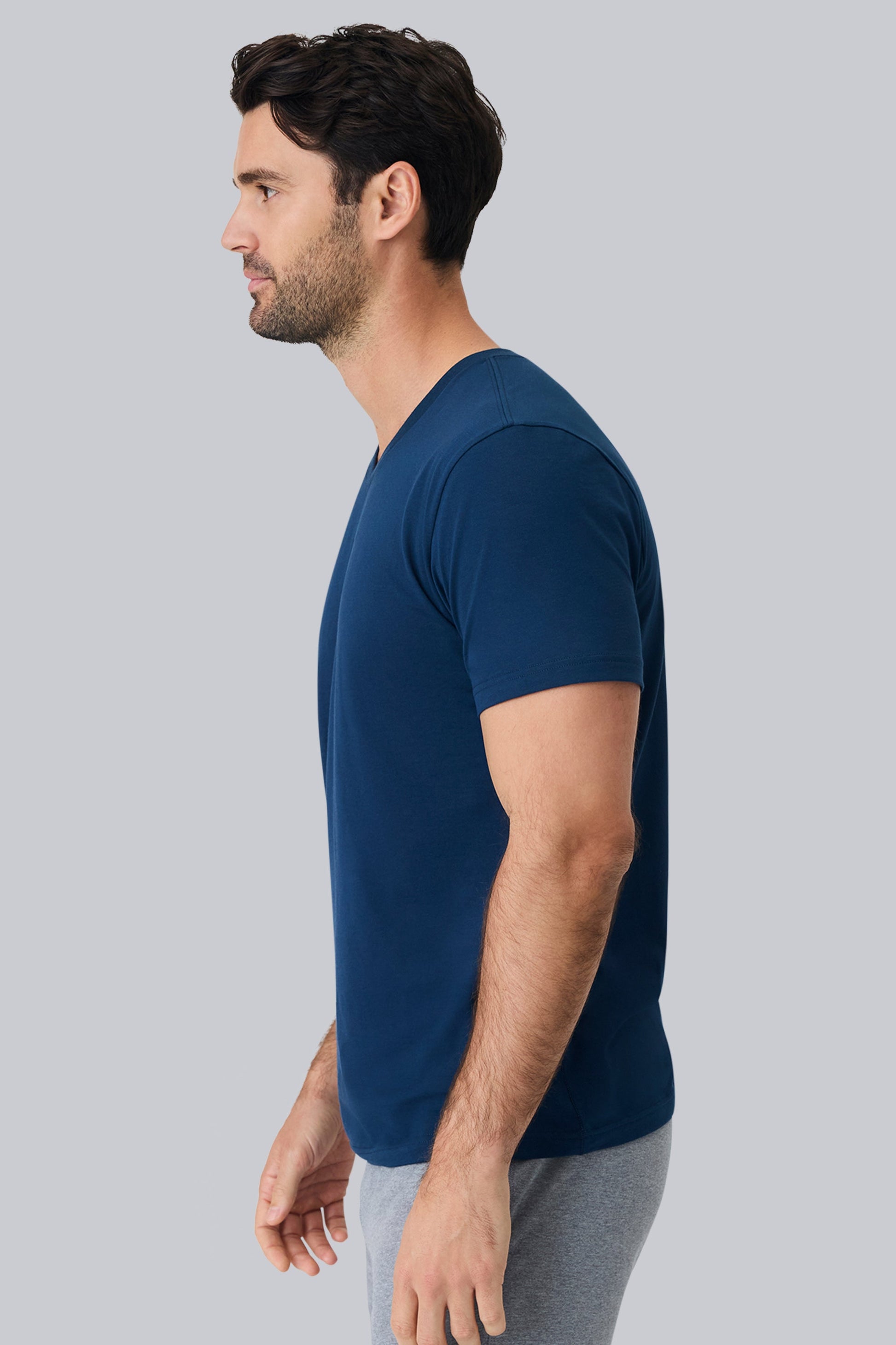 Side view of a man wearing Pima V Neck in True Navy 