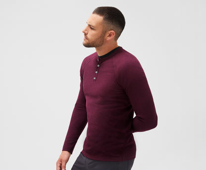 Side view of a man wearing WARMKNIT Waffle Henley in Lambrusco Heather
