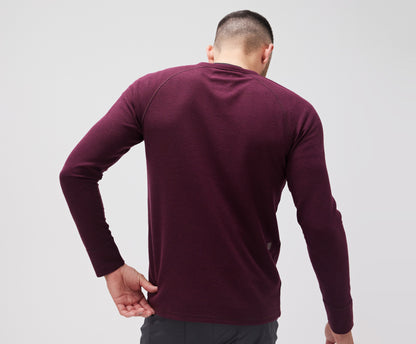 Back view of a man wearing WARMKNIT Waffle Henley in Lambrusco Heather