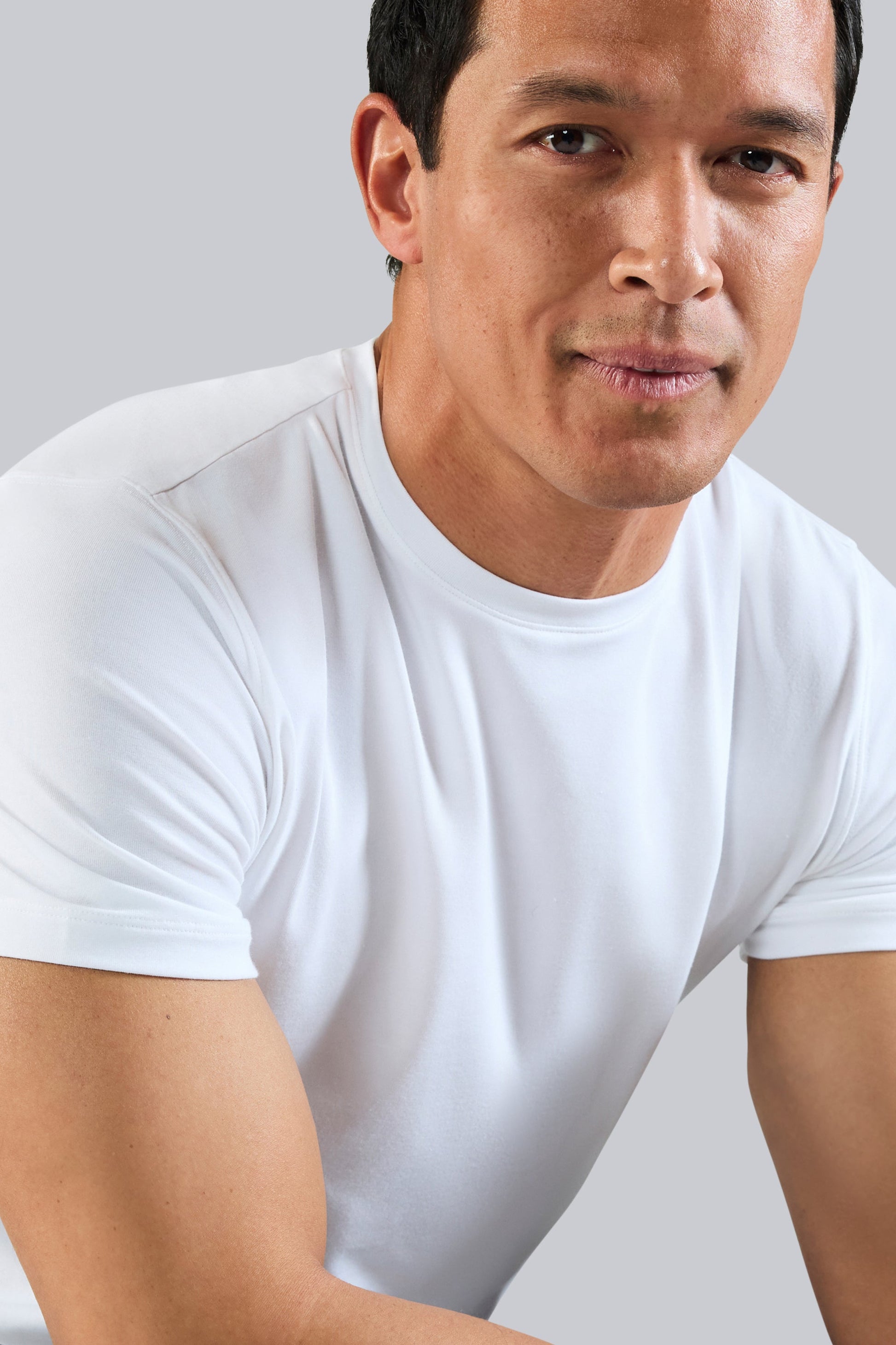 Close up view of a man wearing Silver Crew Neck T-shirt in Bright White
