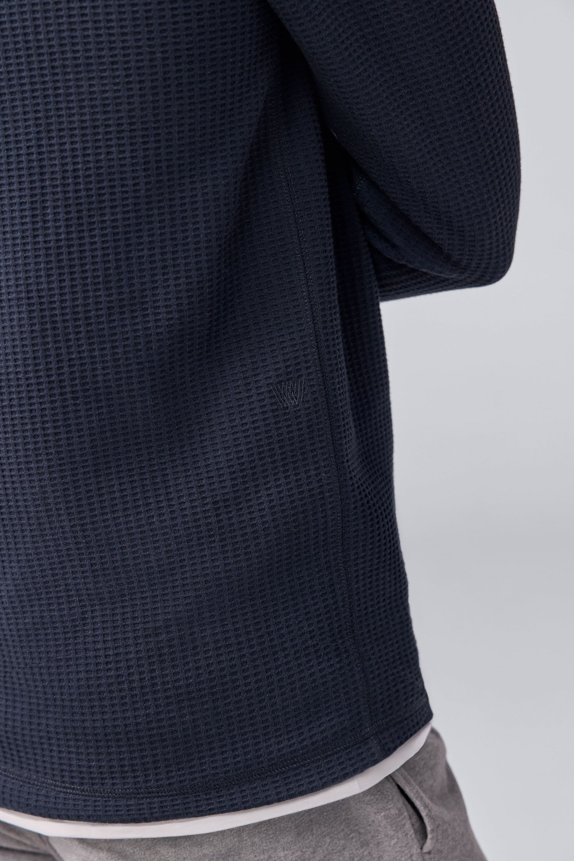 Mack Weldon logo on the back of Warmknit Waffle Long Sleeve Henley in Total Eclipse.
